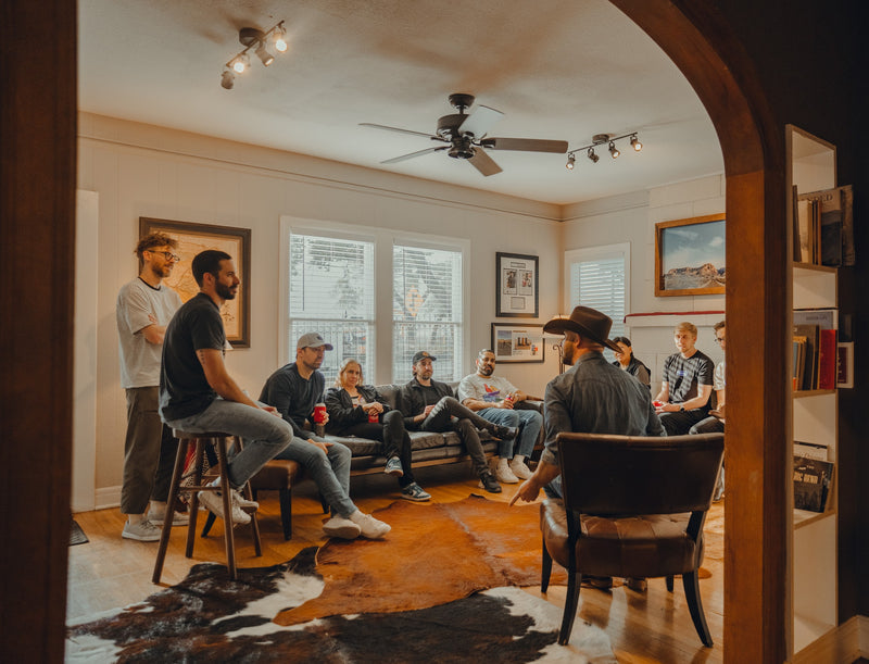 Guests seated in the main room at Chisos HQ during a group boot fitting
