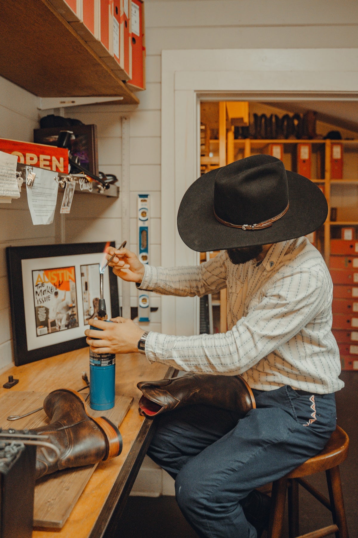Branding a cowboy boot at the workbench at Chisos HQ