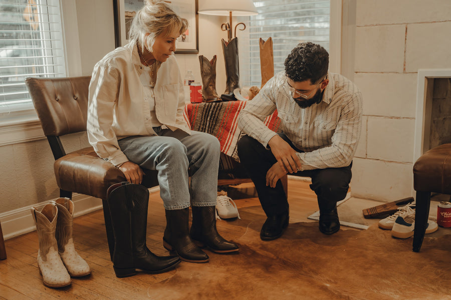A guest tries on boots during a one-on-one fitting at Chisos HQ