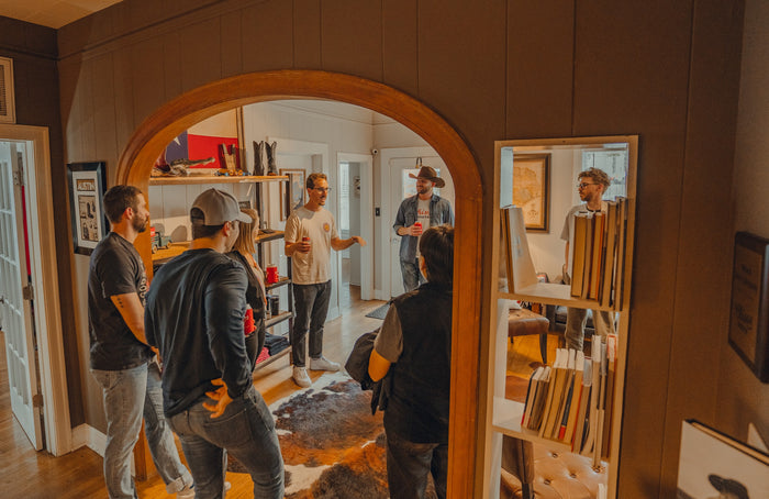 Guests browse boots through the arched doorway at Chisos HQ