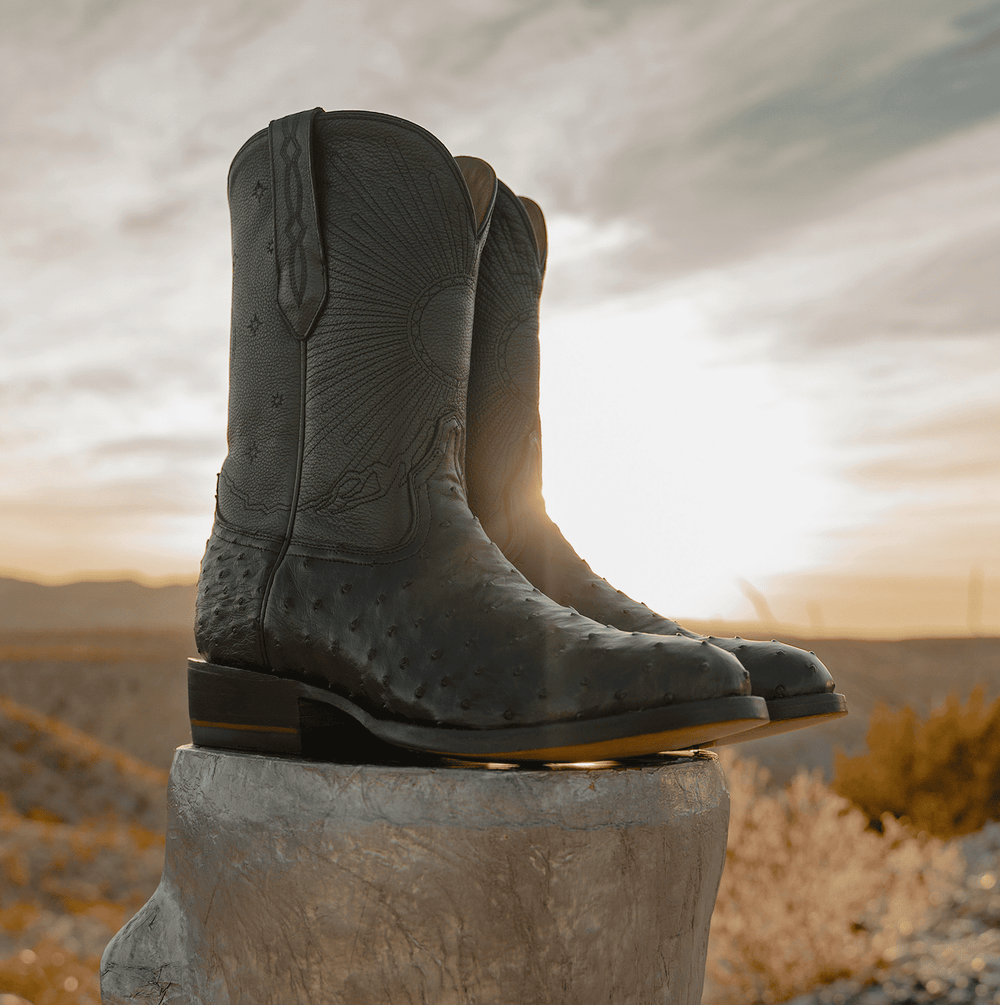 Chisos No. 1 black ostrich wedding cowboy boots displayed outdoors